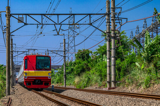 Train driving along a railway track, Jakarta, Indonesia