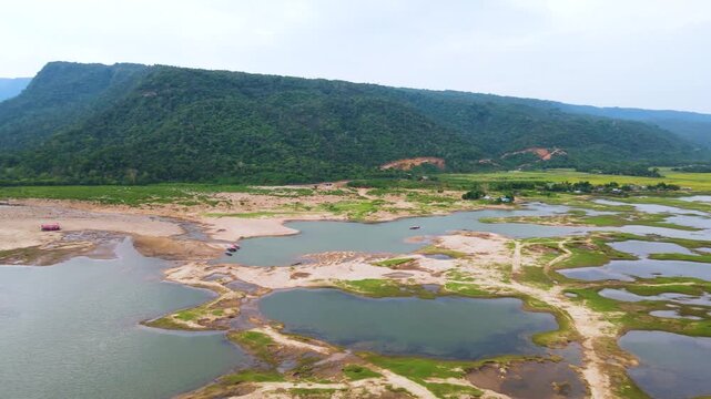 Aerial view of hill landscape with dry river and sandbanks in Bichanakandi, Sylhet, Bangladesh.