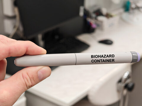 BIOHAZARD CONTAINER pharmaceutical production and packaging concept in pharmaceutical research laboratory