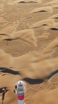 Drone flyover revealing Punta del Fangar Lighthouse in Ebro Delta Natural Park, Deltebre, Catalonia, Spain
