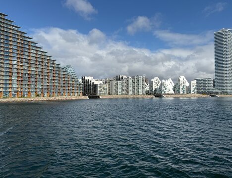 View into land of modern waterfront apartment buildings including the Iceberg, Aarhus Docklands, Aarhus, Jutland, Denmark