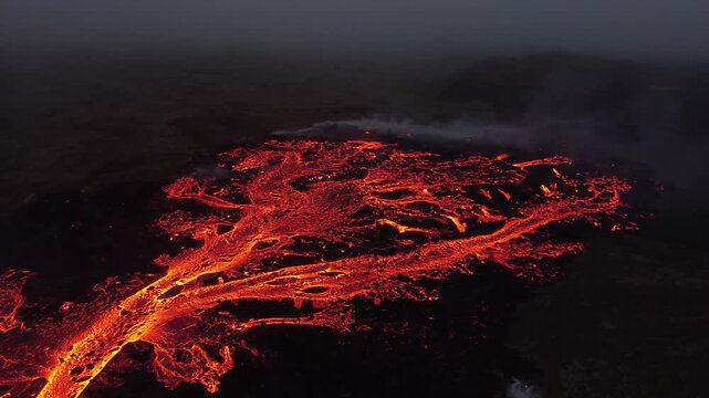 Aerial view of glowing lava flows from the Litli-Hrutur volcanic eruption in Grindavik, Grindavikurbaer, Iceland.