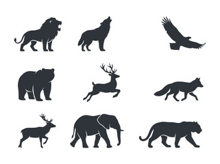 Obraz premium A collection of various wild animal silhouettes including a lion wolf eagle bear deer fox and elephant.