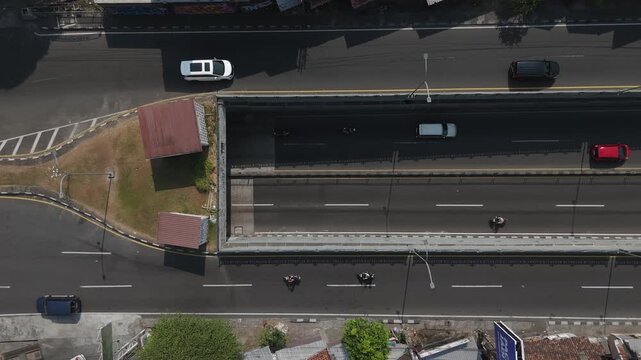 Aerial view of Underpass Kentungan with traffic on the road in Kecamatan Depok, Daerah Istimewa Yogya, Indonesia.