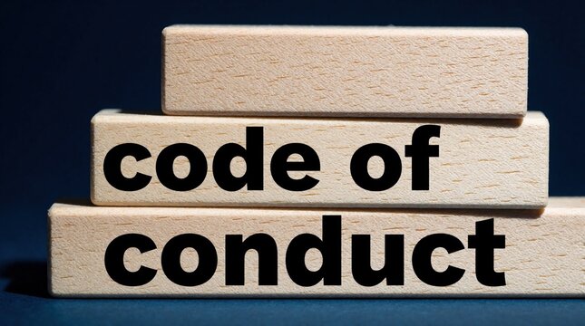 Text code of conduct printed on wooden blocks stacked on dark background. Business concept for rules, pro ethics. Company policy regulation, corporate compliance standard. Legal integrity, human
