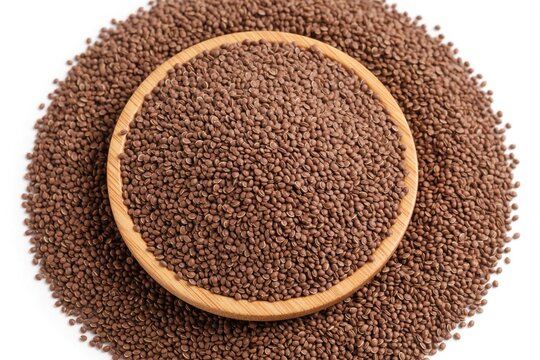 Small organic camelina sativa seeds in round wooden bowl on white table surface. Raw plant ingredient for healthy cooking industrial oil production. Pile of dry brown grain spice used for vegan food