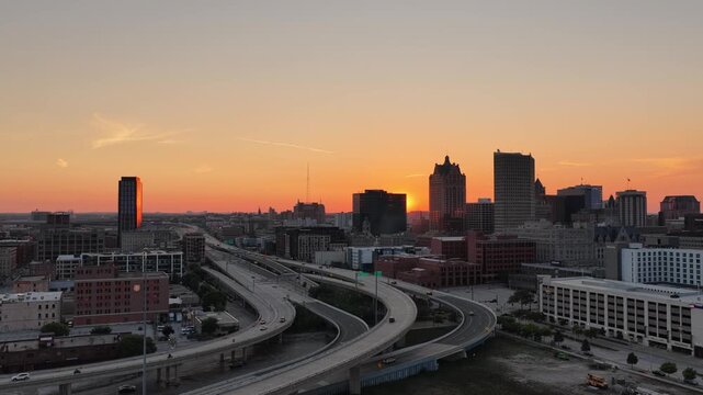  Aerial View of Milwaukee Skyline Silhouette at Sunset with Highway Interchange&rdquo; on August 3 of 2026 Aerial view of downtown Milwaukee, Wisconsin at sunset, with skyscrapers silhouetted against a glow