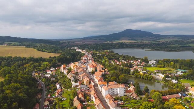 Aerial view of the historic town of Ustek with its traditional buildings and nearby lake in Usti nad Labem Region, Czechia.
