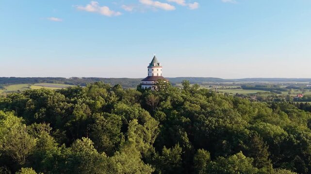 Aerial view of Humprecht hunting lodge surrounded by lush green forests on a sunny day in Sobotka, Kralovehradecky kraj, Czechia.