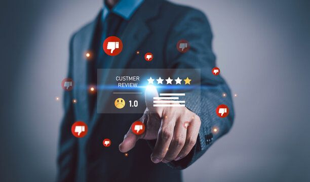 Businessman selecting a negative customer review and low rating on digital interface, representing poor service, customer dissatisfaction, feedback, reputation, and online experience.