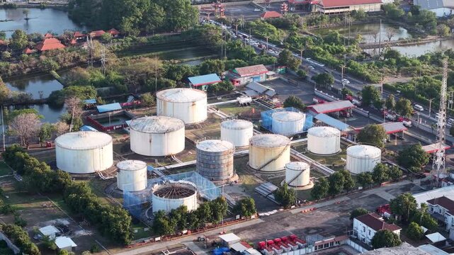 Aerial view of Pertamina Fuel Depot with large storage tanks and industrial infrastructure in Kecamatan Denpasar Selatan, Bali, Indonesia.