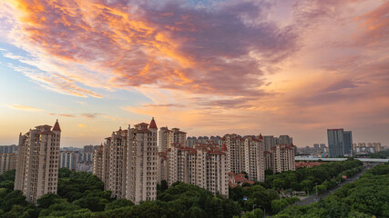 Fototapeta premium Residential Skyline Under Dramatic Sunset Clouds