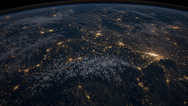 Austria at night from above, outlined in golden light with illuminated cities, road networks and the dark Alpine landscape.