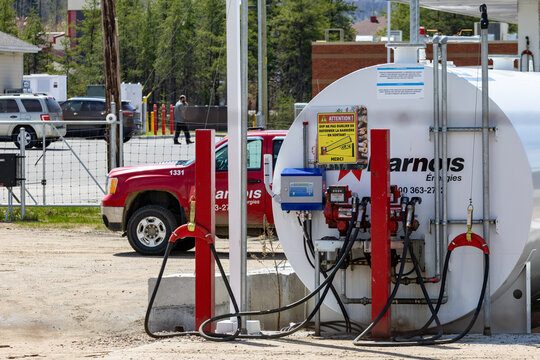 La Tuque, Quebec, 16 May 2026 : Arnois Energies fuel tank and pumps stand ready for service next to a company pickup truck