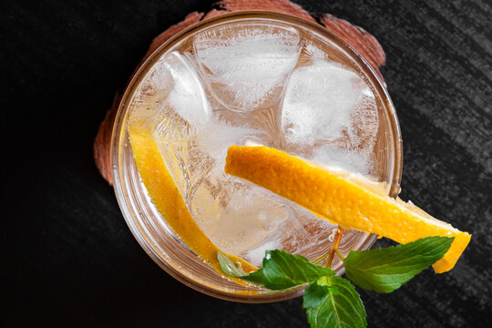 Top View of Refreshing Citrus Cocktail With Orange Slices Mint and Ice