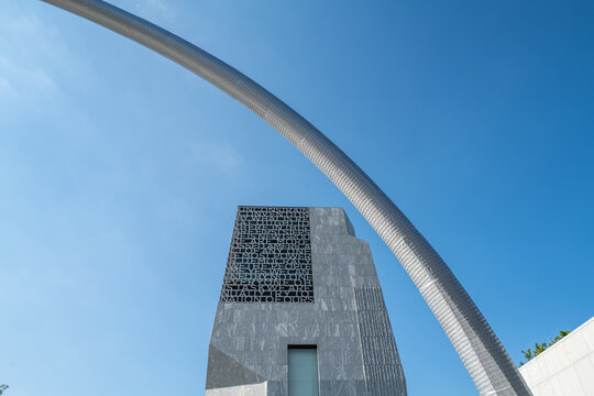 Steel arch sculpture Bending the Arc by Martin Puryear frames the Obama Presidential Center tower with text from President Obama's 2015 Selma speech, Jackson Park, Chicago. July 2026