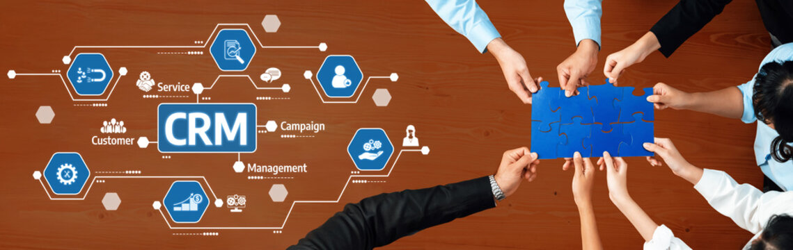A diverse team collaboratively working on a CRM strategy, connecting puzzle pieces while incorporating digital icons to represent business processes and customer relationships. Amity