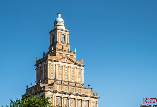 Newark, NJ - US - Jul 26, 2026 Historic American Insurance Company Building in warm brick with classical detail and a copper-domed tower, now known as Ruth Bader Ginsburg Hall in Newark.