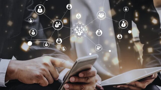 Hands using smartphone and tablet with digital network connections representing communication links and social interactions in a modern workplace setting Gluon.