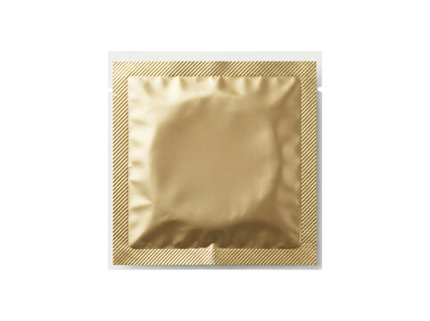 Gold condom foil packet isolated. Metallic contraceptive wrapper for safe sex protection.
