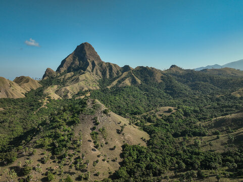 Aerial view of the rolling hills and lush green landscape of Nuca Molas in Satar Mese Barat, East Nusa Tenggara, Indonesia.
