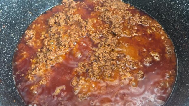 Top down view of thick bolognese sauce with ground beef