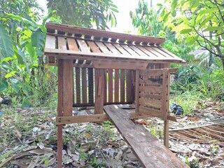 Traditional Handmade Wooden Chicken Coop in Rural Village © My Sinambela