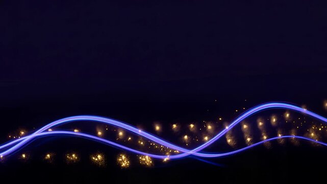 Abstract light trails with glowing sparks in dark background for artistic design