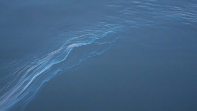 Wavy blue water surface with light reflections