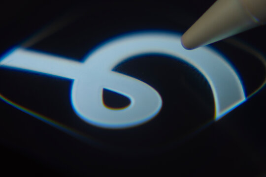 San Francisco, United States - 03 Aug 2026: Close-up of the Happn app icon on a smartphone screen with a stylus.