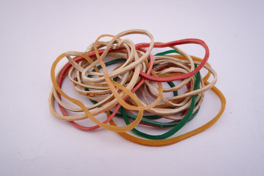A tangled pile of colorful stationery rubber bands