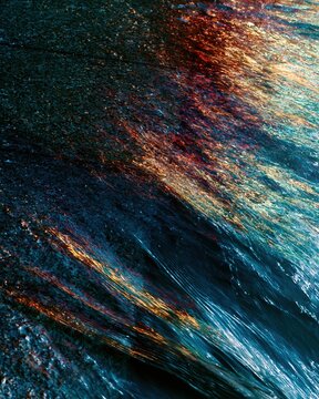 Abstract water ripples and damp promenade stone with warm firework reflections for National Day celebration backgrounds