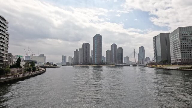 Sumida River Cityscape with Modern Skyscrapers and Waterfront Architecture in Tokyo