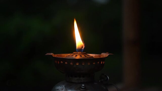 Vintage Kerosene Oil Lamp Burning in Dark Night, Traditional Flame Lighting Close Up