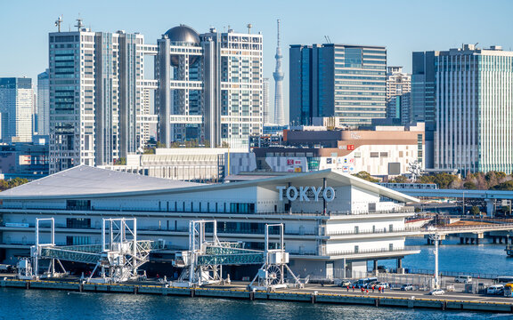 Tokyo International Cruise Terminal and Fuji TV building view with Skytree in background on Odaiba island in Japan