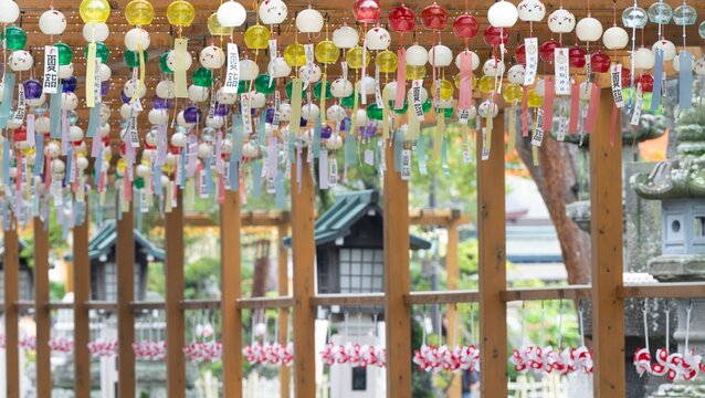 Traditional glass wind chimes and pinwheels decorated at Japanese Shinto shrine