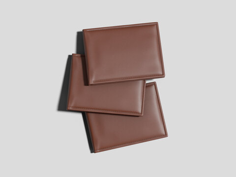 Brown leather wallets stacked overhead view mockup
