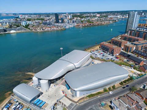 Aerial view of the modern Woolston Water Treatment Plant with its distinctive curved metallic roofs situated on the waterfront in Southampton, England, United Kingdom.