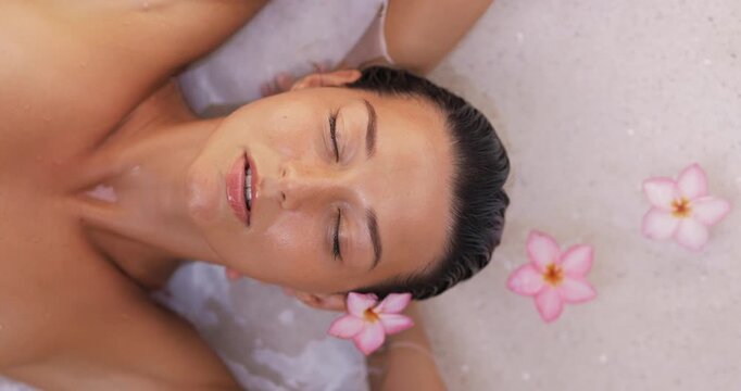 Serene Woman Floating In Bathtub With Flowers, Cinematic Slow Motion Top