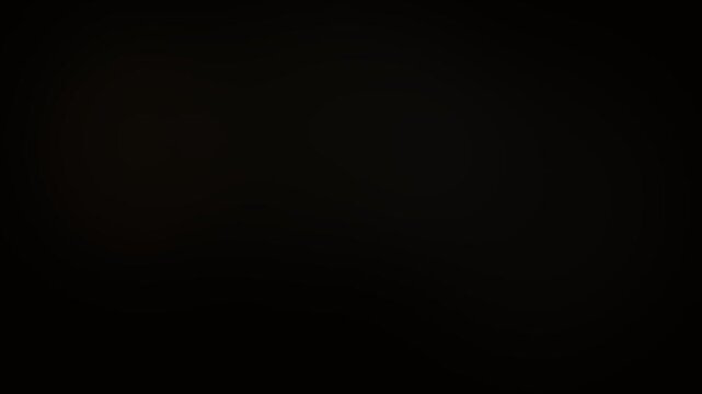 Smooth gold light gradients flowing across a dark background creating elegant motion video effects with soft ethereal transitions and warm glowing atmosphere for artistic cinematic presentations in th