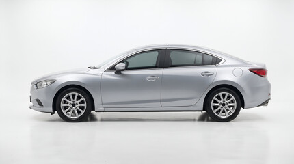 Fototapeta premium Modern White Sedan Car Isolated Side View in Studio Setup with White Background