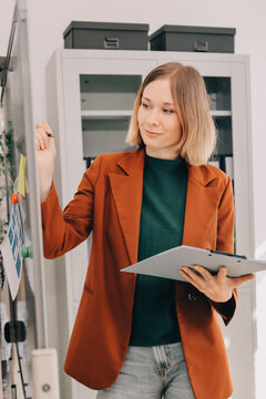 Woman smiling to herself as she works in an office