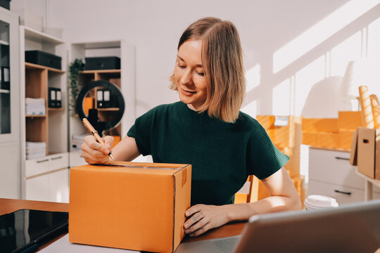Logistics, small business woman with checklist for stock, clothes order or retail inventory management. Shipping, writing or person at ecommerce startup store for sme delivery with fashion designer