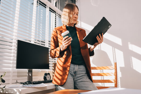 Logistics, small business woman with checklist for stock, clothes order or retail inventory management. Shipping, writing or person at ecommerce startup store for sme delivery with fashion designer
