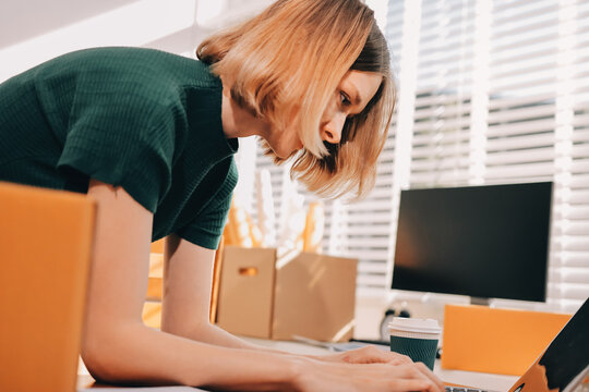 Logistics, small business woman with checklist for stock, clothes order or retail inventory management. Shipping, writing or person at ecommerce startup store for sme delivery with fashion designer