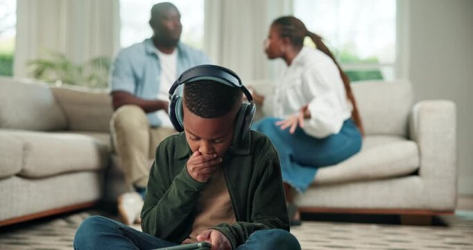 Stress, tablet and black child with parents fighting in home for argument, conflict or divorce. Kid, son or headphones with technology, mom or dad in disagreement for break up, separation or dispute
