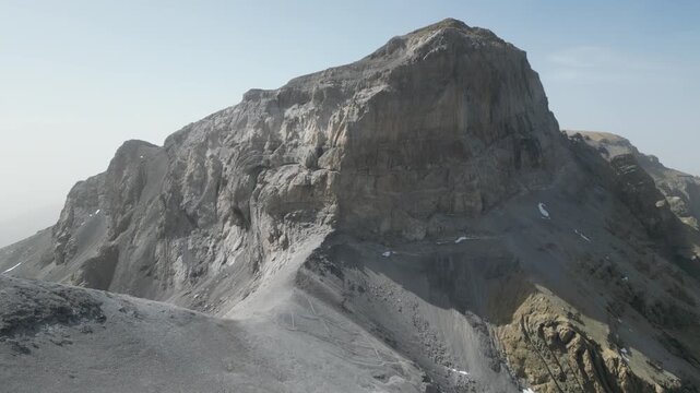 Stunning aerial view of the majestic Mallo de Marmor&eacute;s \ Cilindro de Marbor&eacute; mountain in the Spanish Pyrenees. Remote and rugged high-altitude landscape with rocky cliffs and trails.