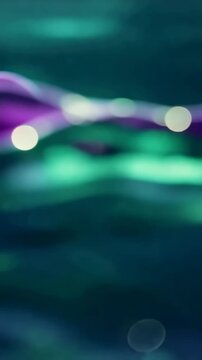 A Captivating Dance of Waves: A Visual Journey Through Hypnotic Fluid Dynamics Featuring Rich Purple and Iridescent Tones Blending Harmoniously Together.