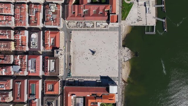 Top-down aerial of Praca do Comercio beside the Tagus River, Lisbon, drone symmetrical alignment ascends