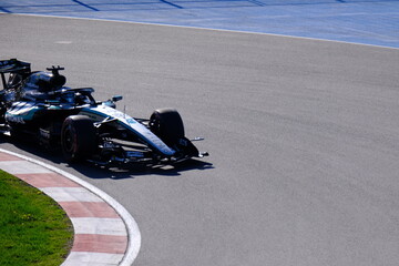 Obraz premium May 24, 2026, Montreal, Canada, Mercedes F1 car racing through Circuit Gilles Villeneuve corner. g.